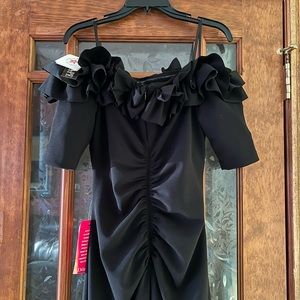Black gown. Size ten with sleeves and off the shoulder. pretty and flattering